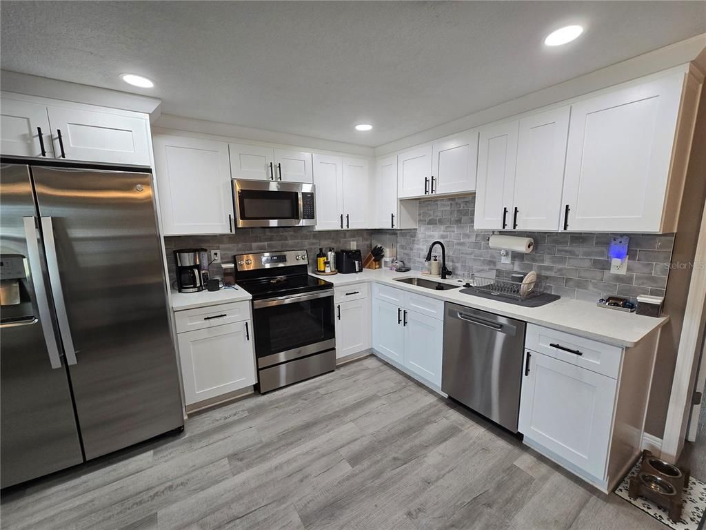 Interior, Kitchen, Recessed Lighting, Stainless Steel Appliances, Wood Texture Flooring