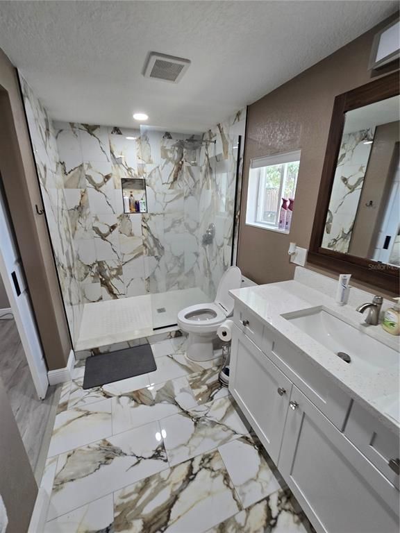 Bathroom, Dual Sink Vanities, Interior, Marble, Marble Walls, Recessed Lighting