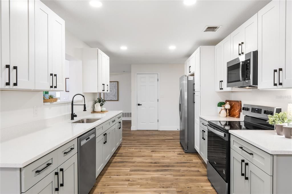 Interior, Kitchen, Recessed Lighting, Stainless Steel Appliances, Wood Texture Flooring