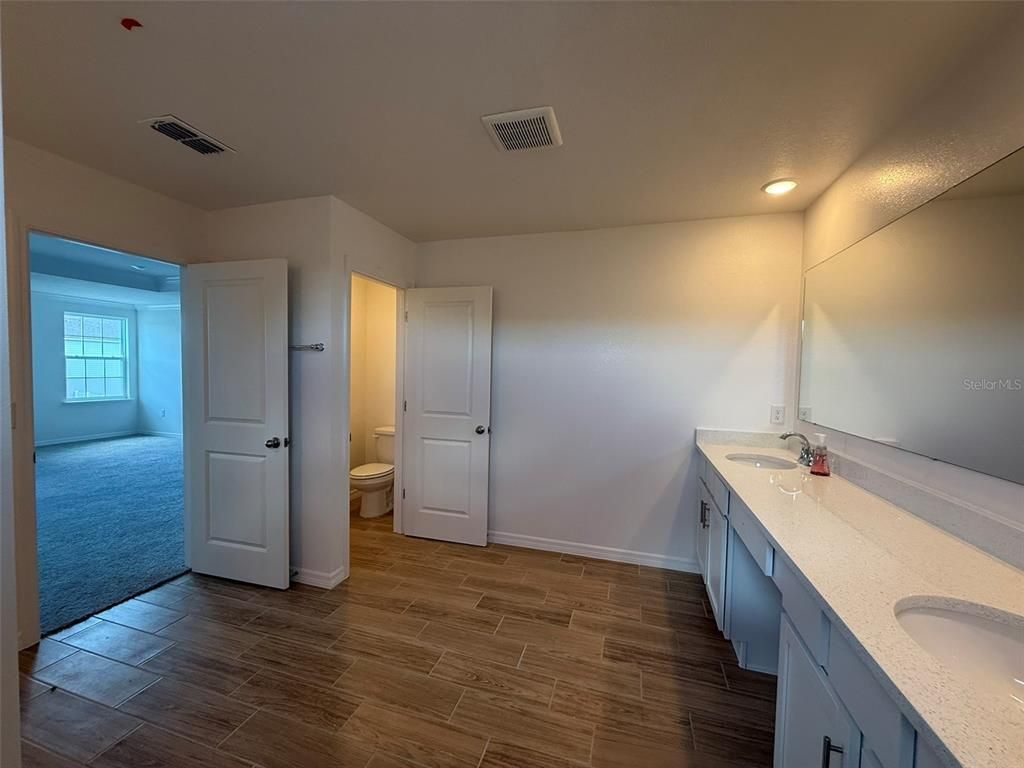 Bathroom, Dual Sink Vanities, Interior, Recessed Lighting, Wood Texture Flooring