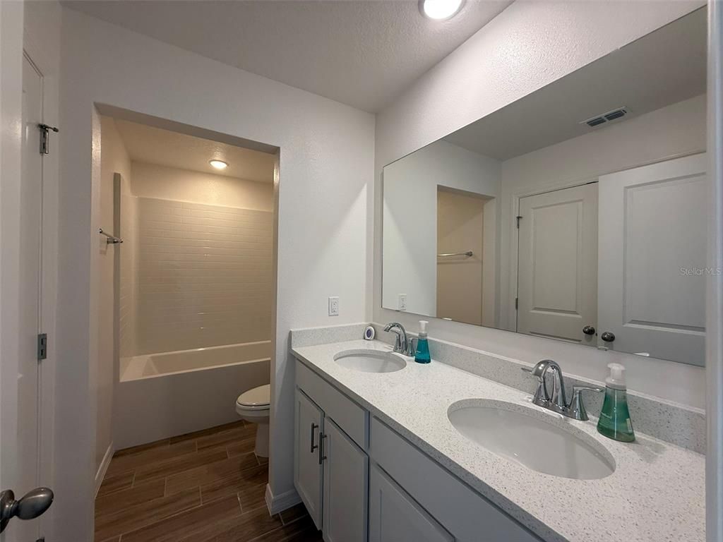 Bathroom, Dual Sink Vanities, Interior, Recessed Lighting, Wood Texture Flooring