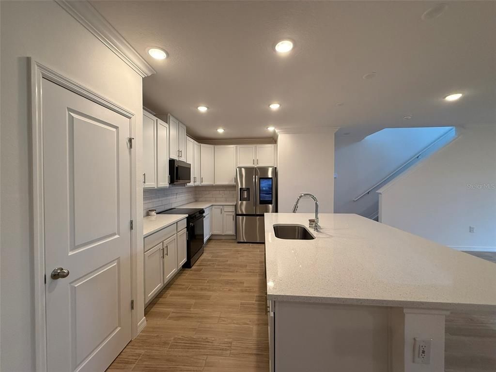 Interior, Kitchen, Recessed Lighting, Stainless Steel Appliances, Wood Texture Flooring