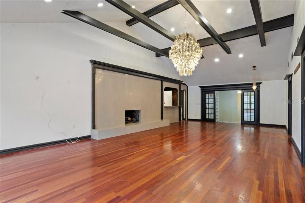 Chandelier, Empty room, Fireplace, Interior, Recessed Lighting, Wood Texture Flooring