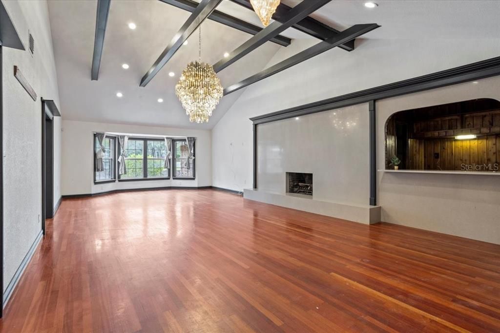 Chandelier, Empty room, Fireplace, Interior, Recessed Lighting, Wood Texture Flooring