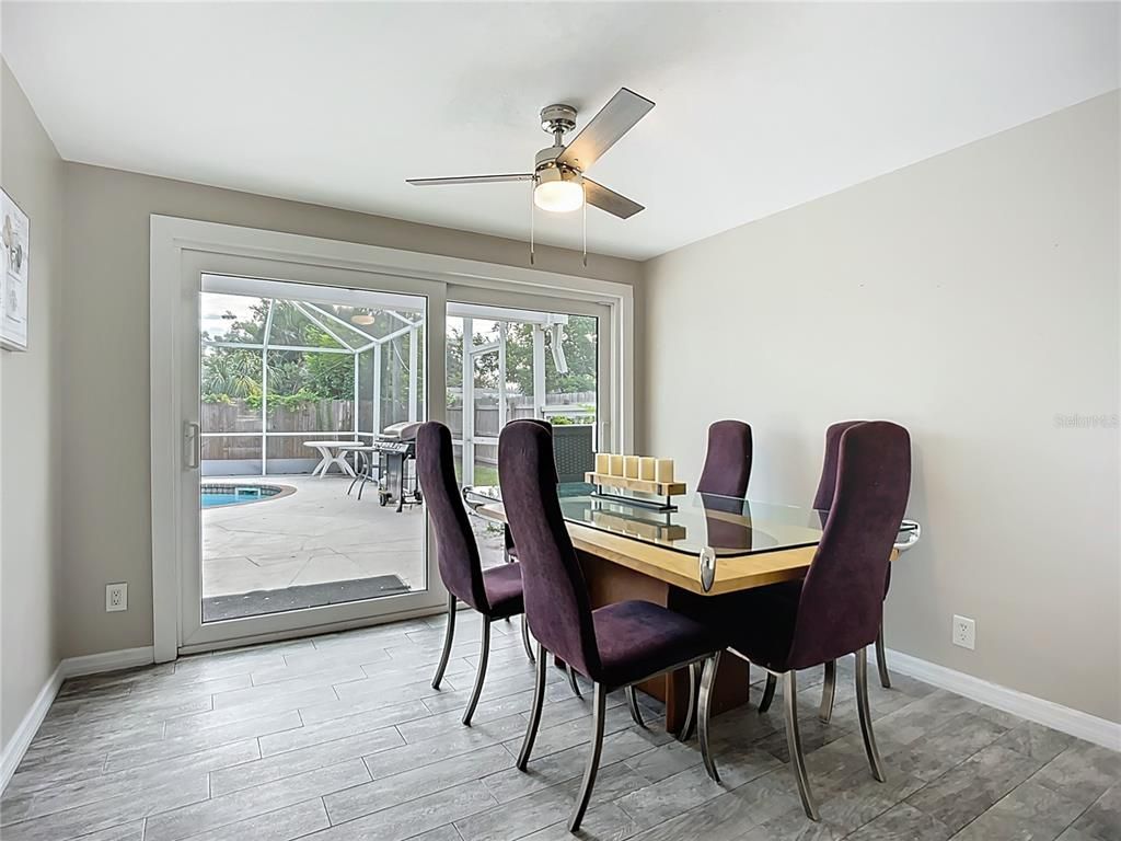 Dining room, Interior, Pool, Sun Room, Wood Texture Flooring