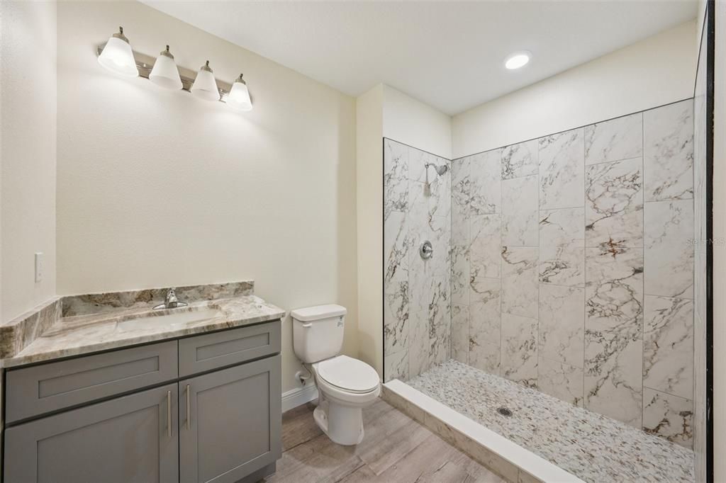 Bathroom, Interior, Marble Walls, Recessed Lighting, Wood Texture Flooring