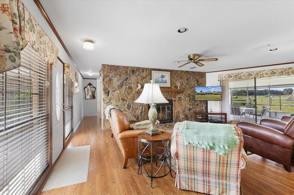 Fireplace, Interior, Living room, Recessed Lighting, Stone Walls, Wood Texture Flooring
