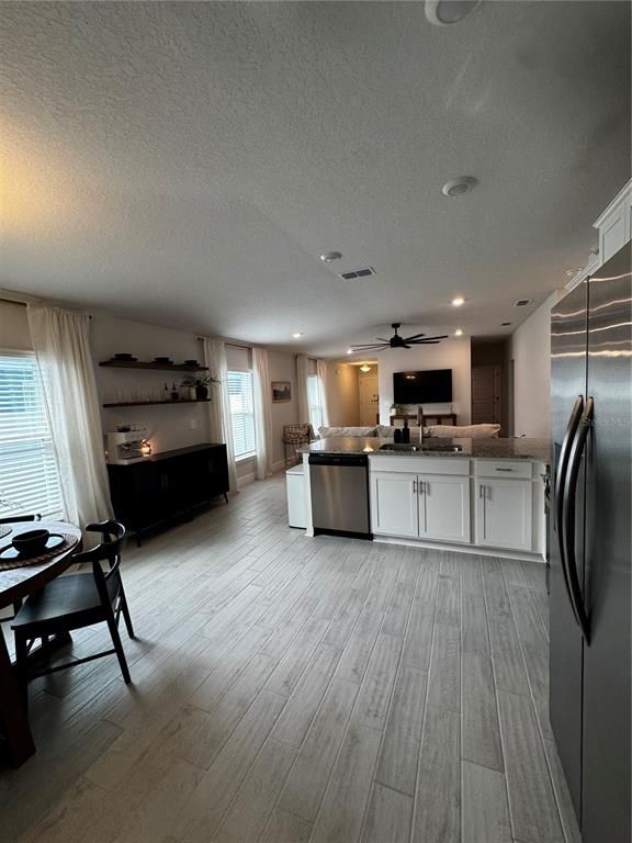 Dining room, Interior, Kitchen, Recessed Lighting, Stainless Steel Appliances, Wood Texture Flooring