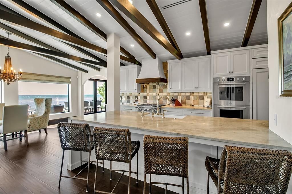 Chandelier, Dining room, Interior, Kitchen, Recessed Lighting, Stainless Steel Appliances, Water, Wooden Beams, Wood Texture Flooring