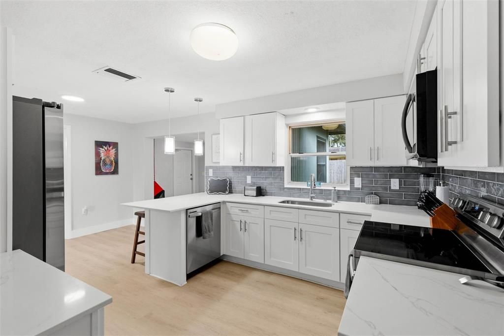 Interior, Kitchen, Pendant Lights, Recessed Lighting, Stainless Steel Appliances, Wood Texture Flooring
