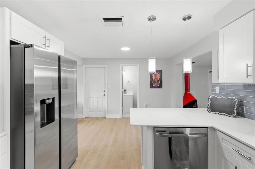 Interior, Kitchen, Pendant Lights, Recessed Lighting, Stainless Steel Appliances, Wood Texture Flooring