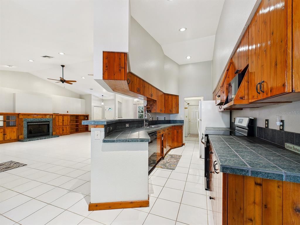 Fireplace, Interior, Kitchen, Recessed Lighting, Tile Countertops