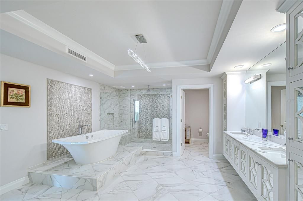 Bathroom, Free Standing Baths, Glass Shower, Interior, Marble, Marble Walls, Pendant Lights, Recessed Lighting
