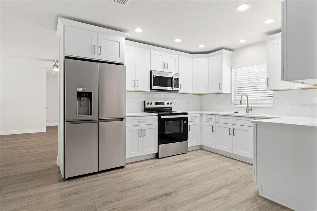 Interior, Kitchen, Recessed Lighting, Stainless Steel Appliances, Wood Texture Flooring