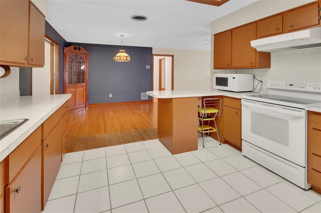 Interior, Kitchen, Pendant Lights, Tile Countertops, Wood Texture Flooring