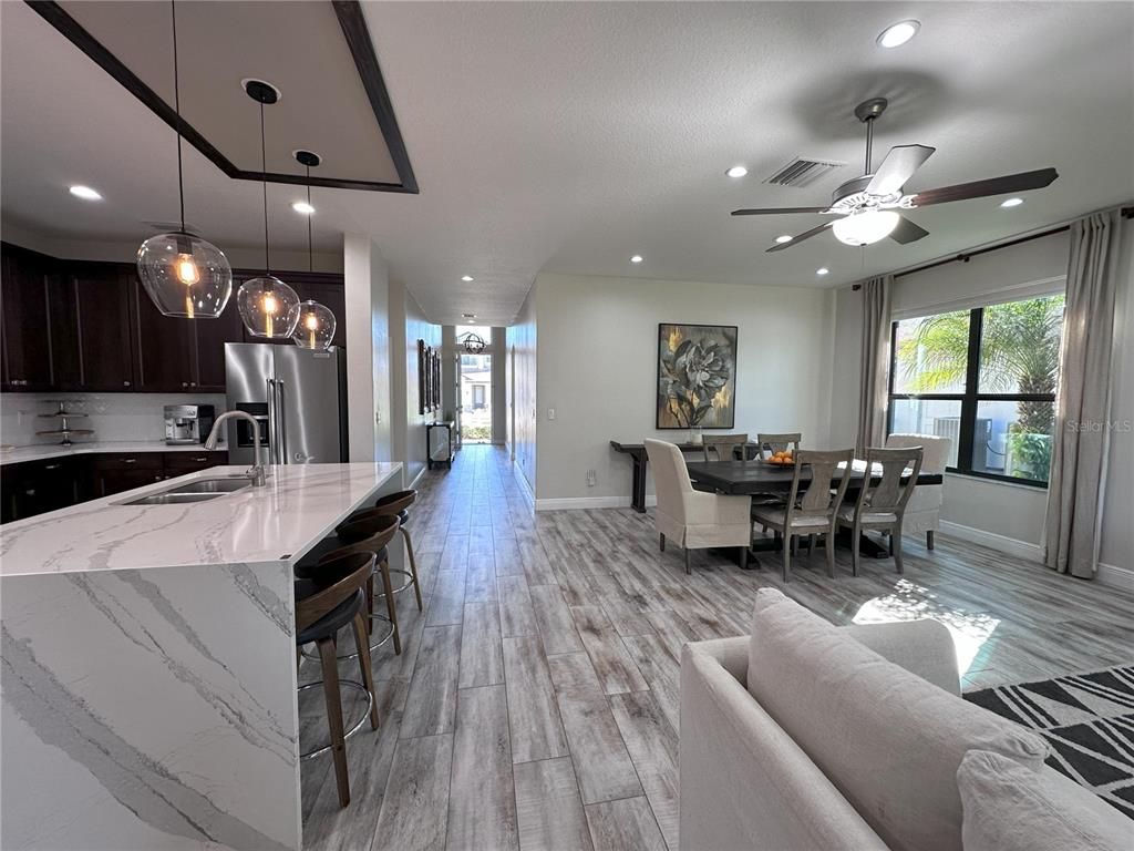 Dining room, Interior, Kitchen, Living room, Pendant Lights, Recessed Lighting, Stainless Steel Appliances, Wood Texture Flooring