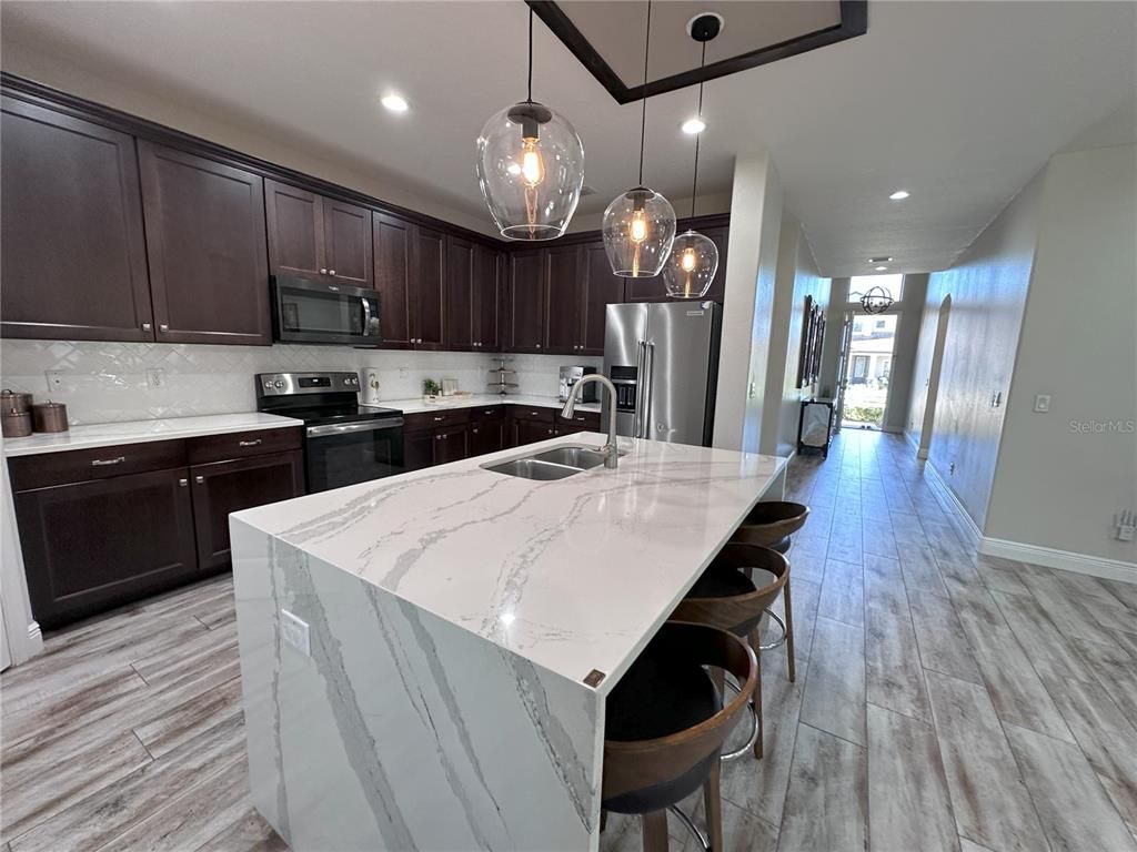 Interior, Kitchen, Pendant Lights, Recessed Lighting, Stainless Steel Appliances, Wood Texture Flooring