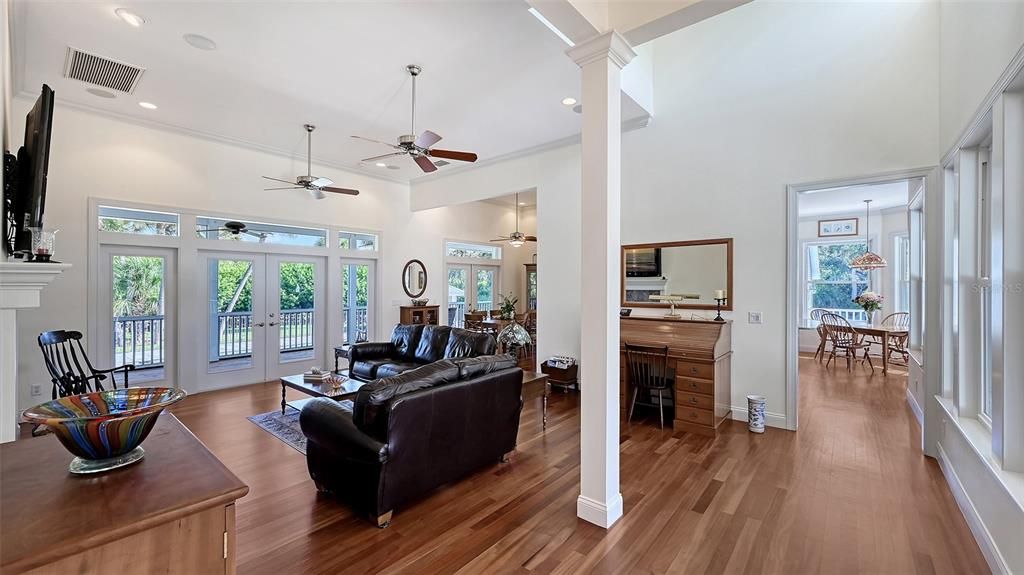 Dining room, Fireplace, Interior, Living room, Recessed Lighting, Wood Texture Flooring