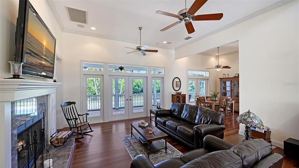 Dining room, Fireplace, Interior, Living room, Recessed Lighting, Wood Texture Flooring