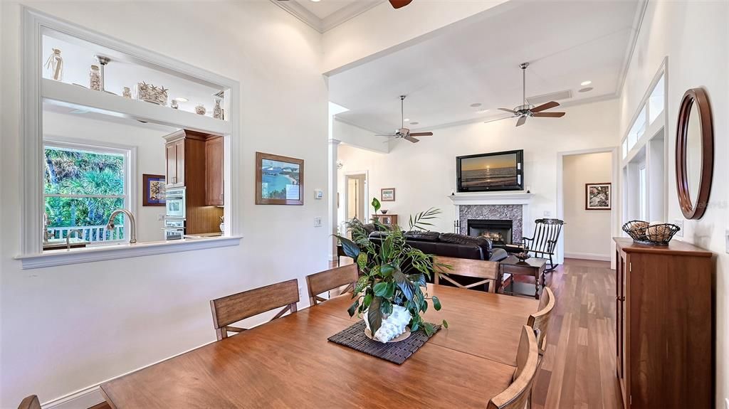 Dining room, Fireplace, Interior, Living room, Recessed Lighting, Wood Texture Flooring