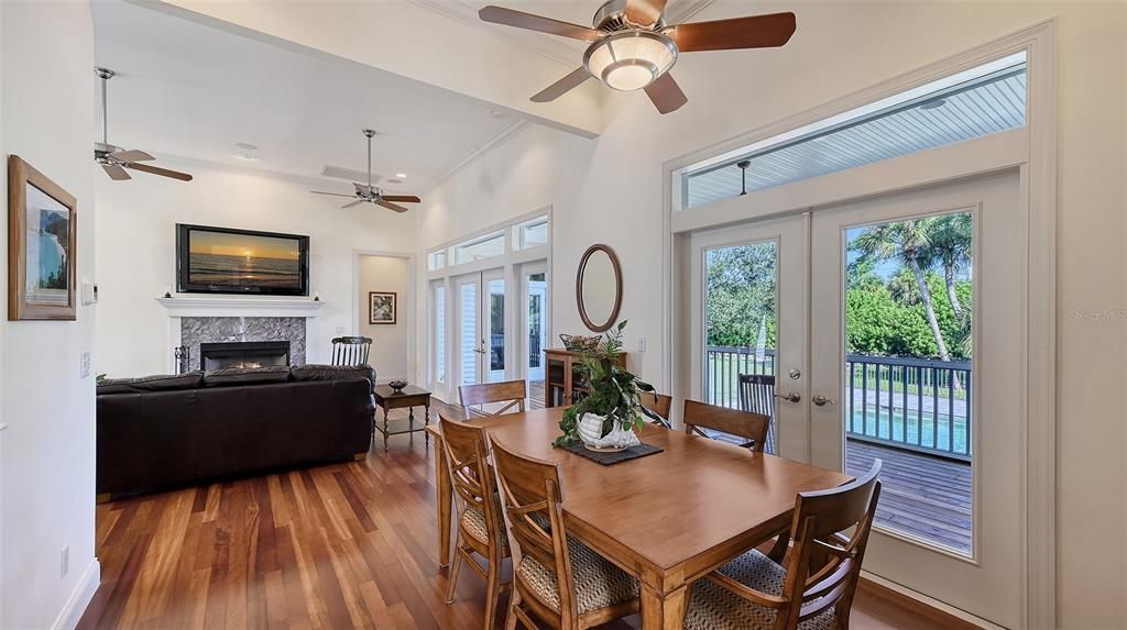 Dining room, Fireplace, Interior, Living room, Recessed Lighting, Wood Texture Flooring