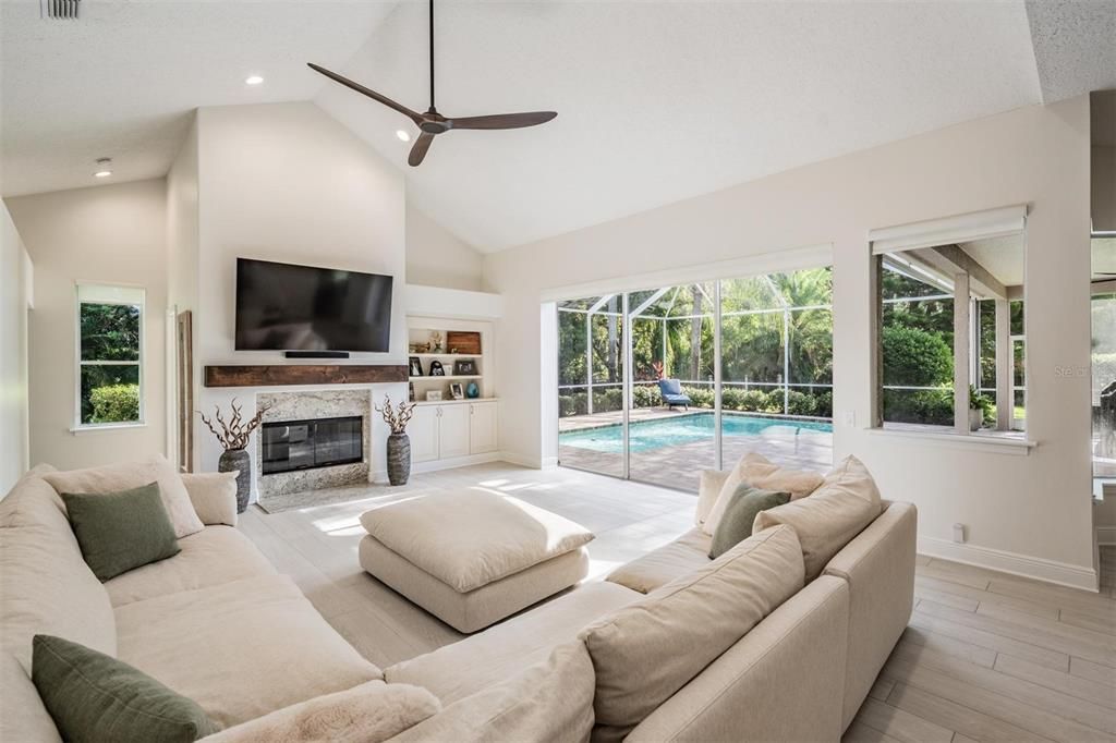 Fireplace, Interior, Living room, Pool, Recessed Lighting, Wood Texture Flooring
