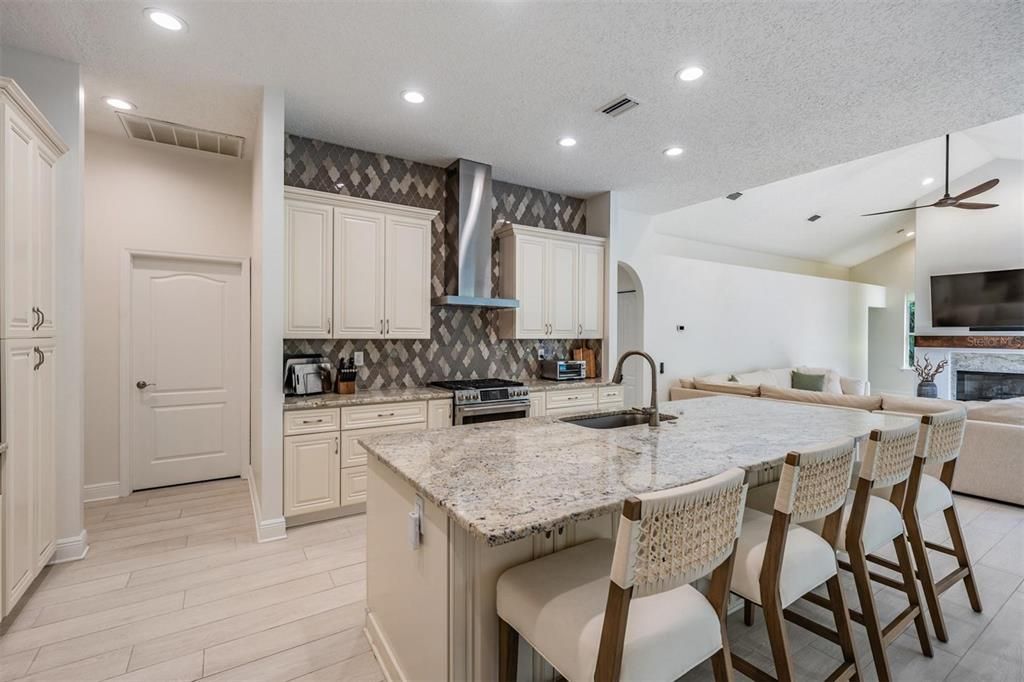 Fireplace, Interior, Kitchen, Recessed Lighting, Wood Texture Flooring