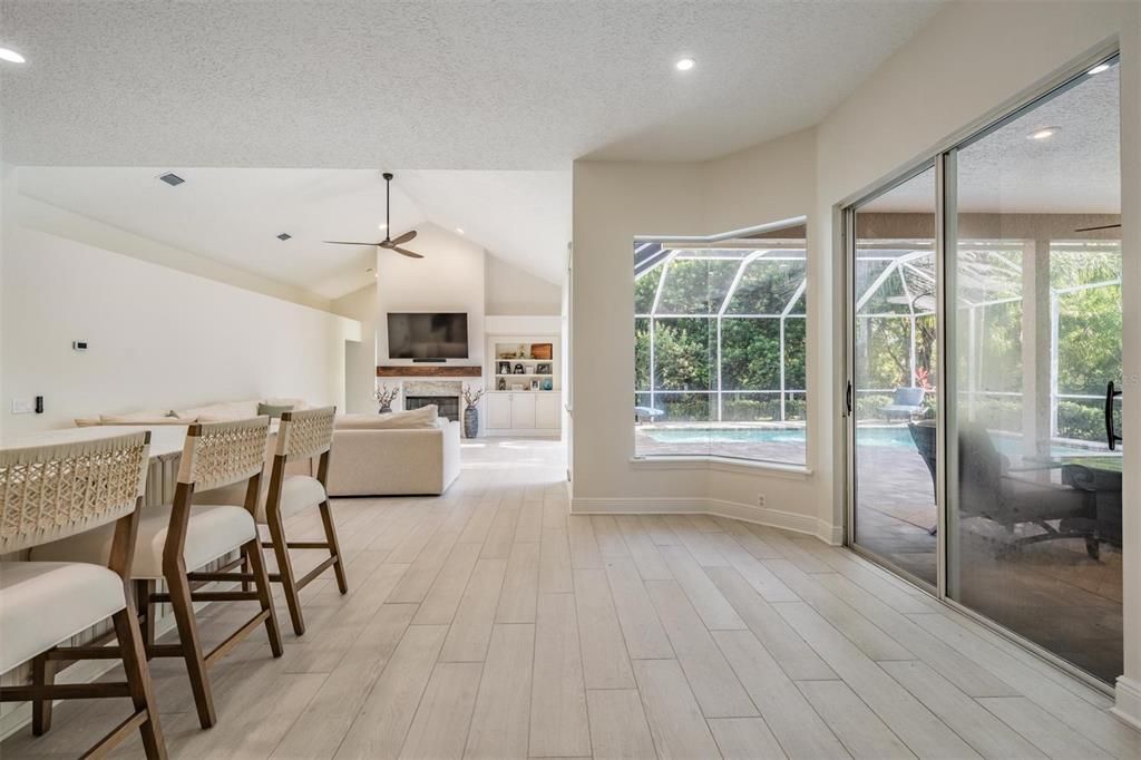 Fireplace, Glass Ceilings, Interior, Living room, Recessed Lighting, Sun Room, Wood Texture Flooring
