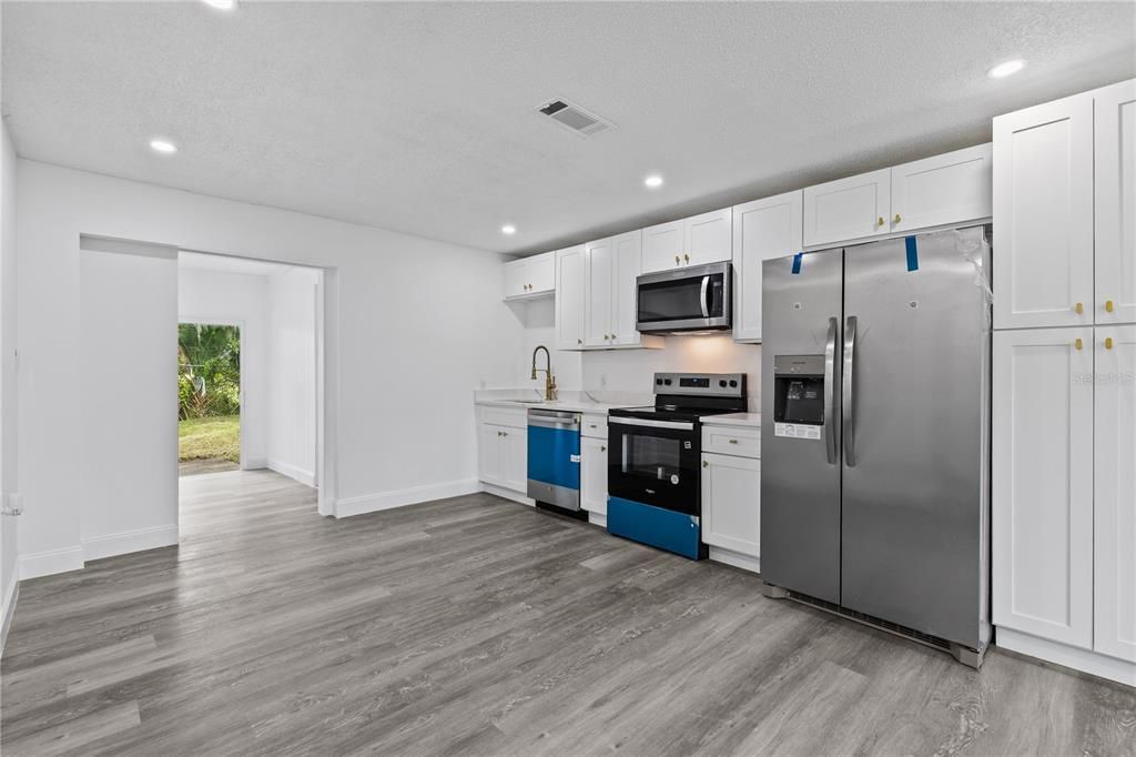 Interior, Kitchen, Recessed Lighting, Stainless Steel Appliances, Wood Texture Flooring