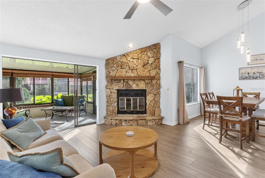 Dining room, Fireplace, Interior, Living room, Pendant Lights, Recessed Lighting, Stone Walls, Wood Texture Flooring