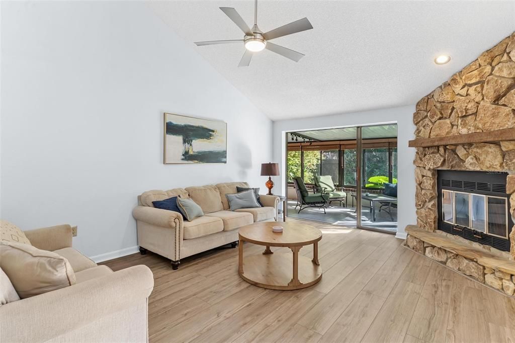 Fireplace, Interior, Living room, Recessed Lighting, Stone Walls, Wood Texture Flooring