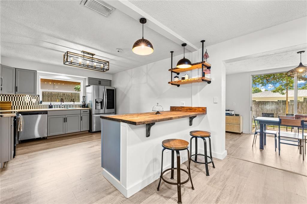 Dining room, Interior, Kitchen, Pendant Lights, Stainless Steel Appliances, Wood Texture Flooring