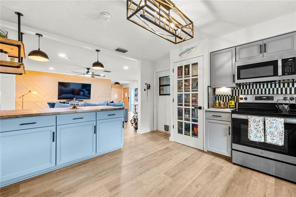 Interior, Kitchen, Pendant Lights, Recessed Lighting, Stainless Steel Appliances, Wood Texture Flooring