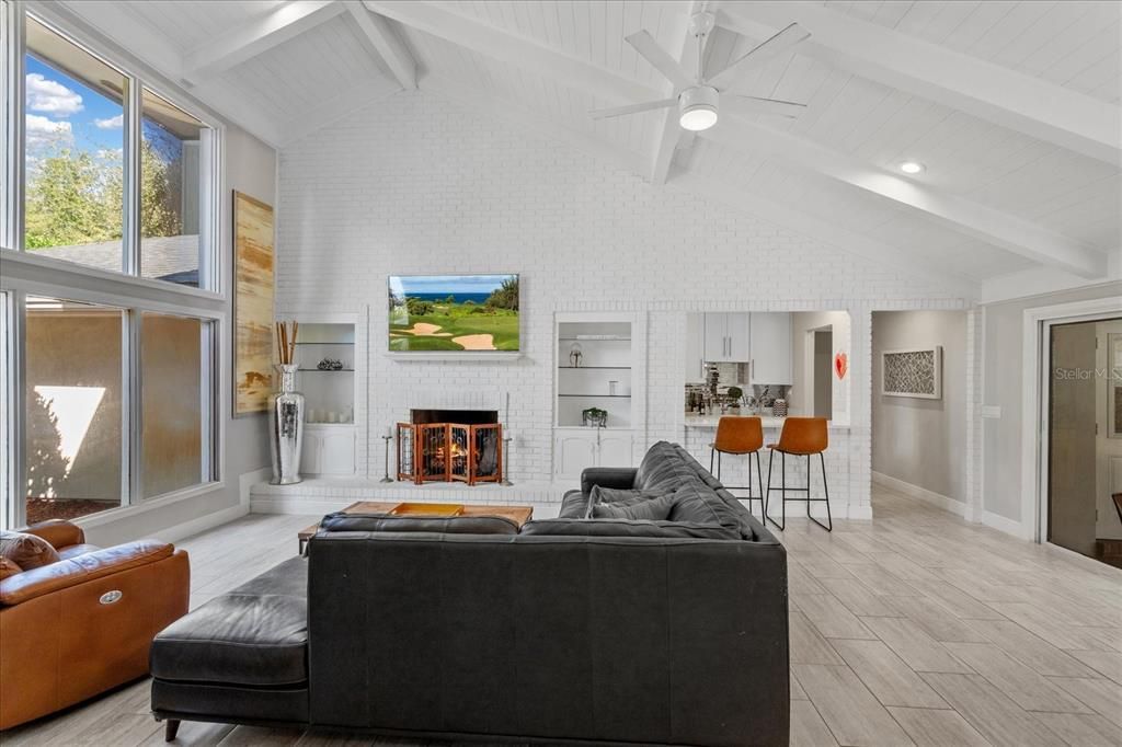 Fireplace, Interior, Living room, Recessed Lighting, Stone Walls, Wood Texture Flooring