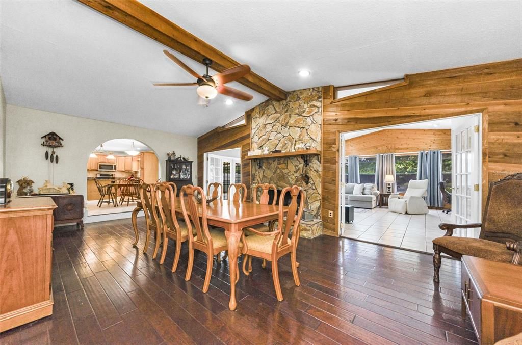 Dining room, Fireplace, Interior, Recessed Lighting, Stone Walls, Wood Texture Flooring, Wooden Walls