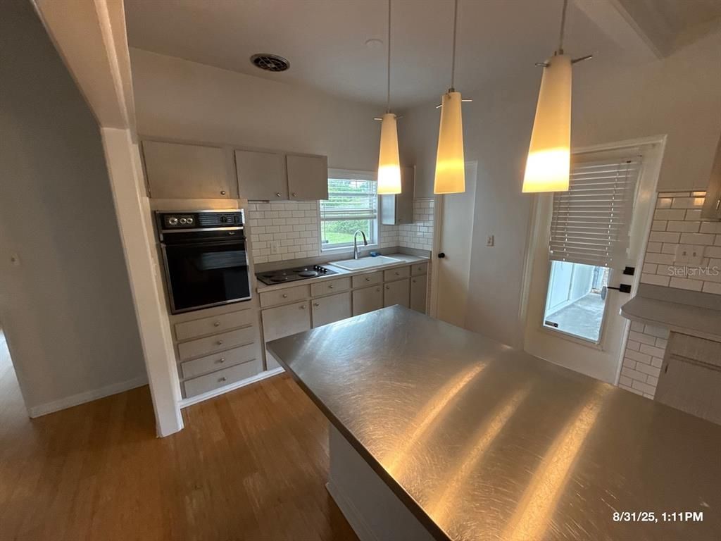 Interior, Kitchen, Pendant Lights, Stainless Steel Appliances, Wood Texture Flooring