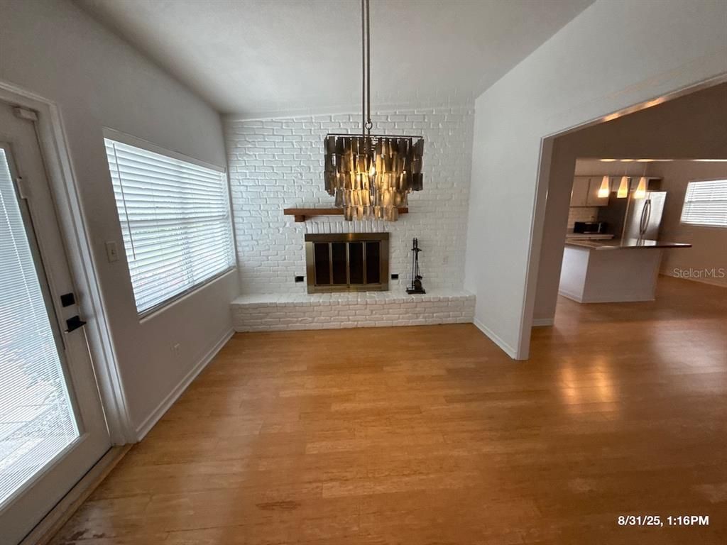 Empty room, Fireplace, Interior, Pendant Lights, Stone Walls, Wood Texture Flooring