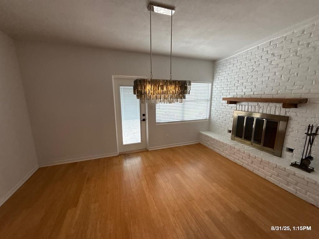 Chandelier, Empty room, Fireplace, Interior, Stone Walls, Wood Texture Flooring