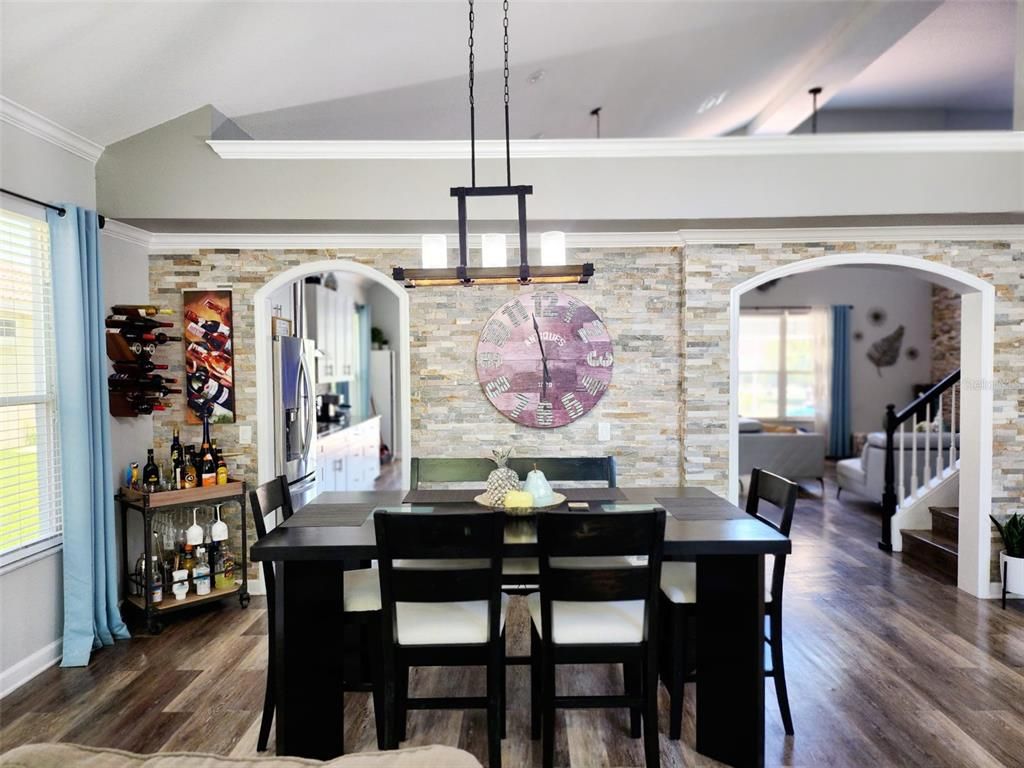 Dining room, Interior, Kitchen, Pendant Lights, Stainless Steel Appliances, Stone Walls, Wood Texture Flooring