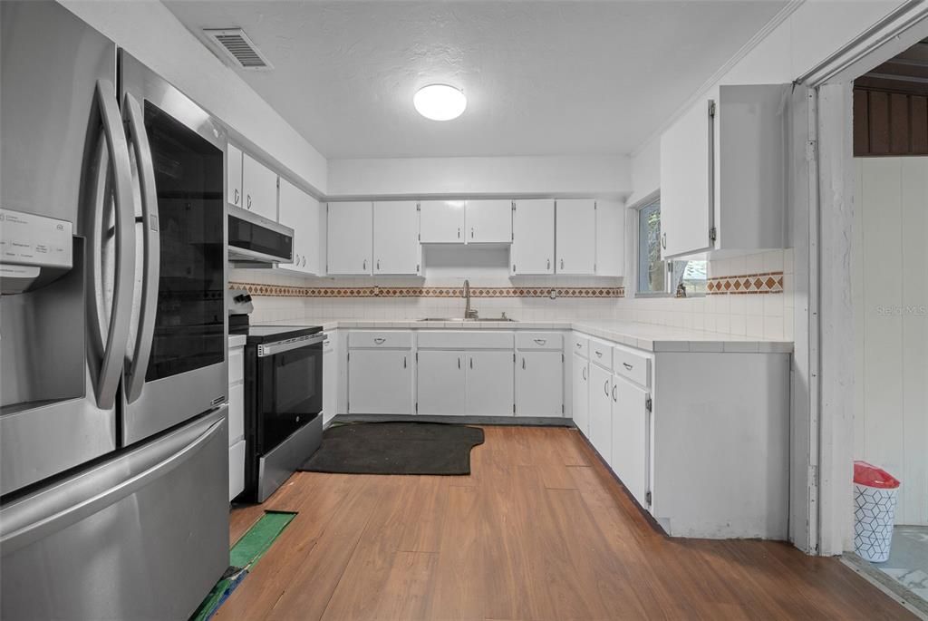 Interior, Kitchen, Tile Countertops, Wood Texture Flooring
