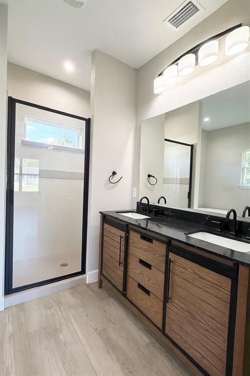 Bathroom, Dual Sink Vanities, Interior, Recessed Lighting, Wood Texture Flooring
