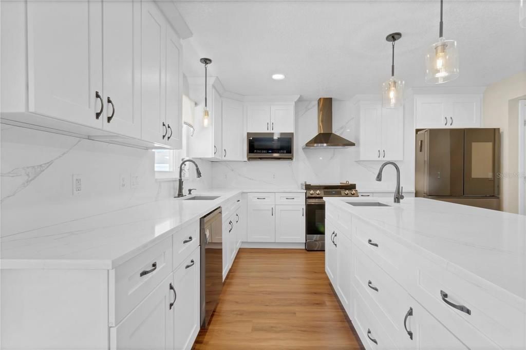 Interior, Kitchen, Marble Walls, Pendant Lights, Recessed Lighting, Stainless Steel Appliances, Wood Texture Flooring