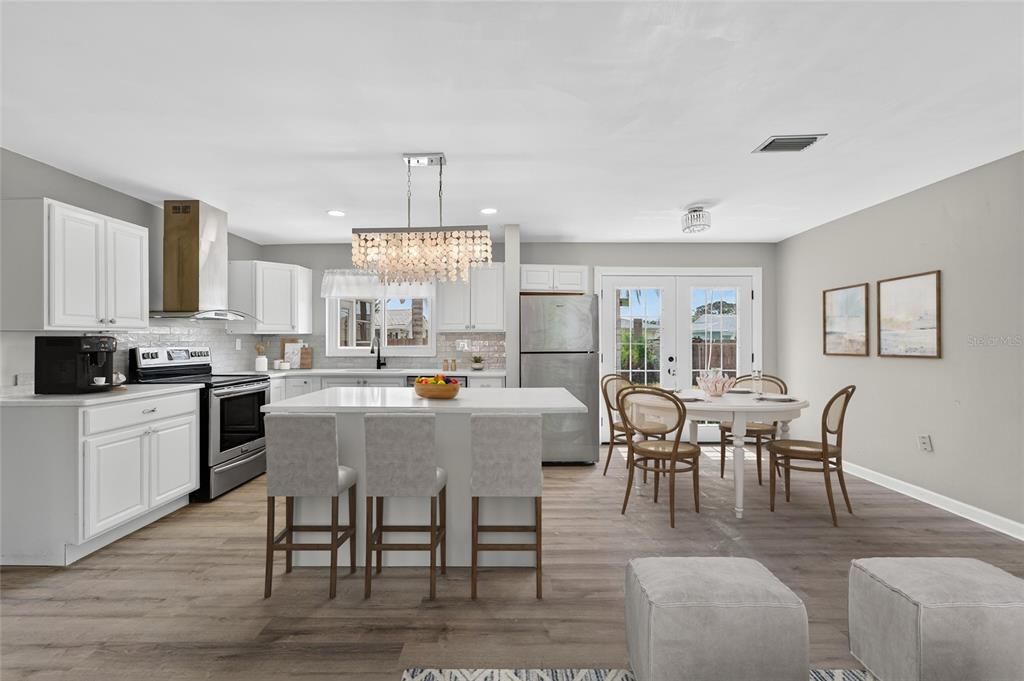 Chandelier, Dining room, Interior, Kitchen, Recessed Lighting, Stainless Steel Appliances, Wood Texture Flooring