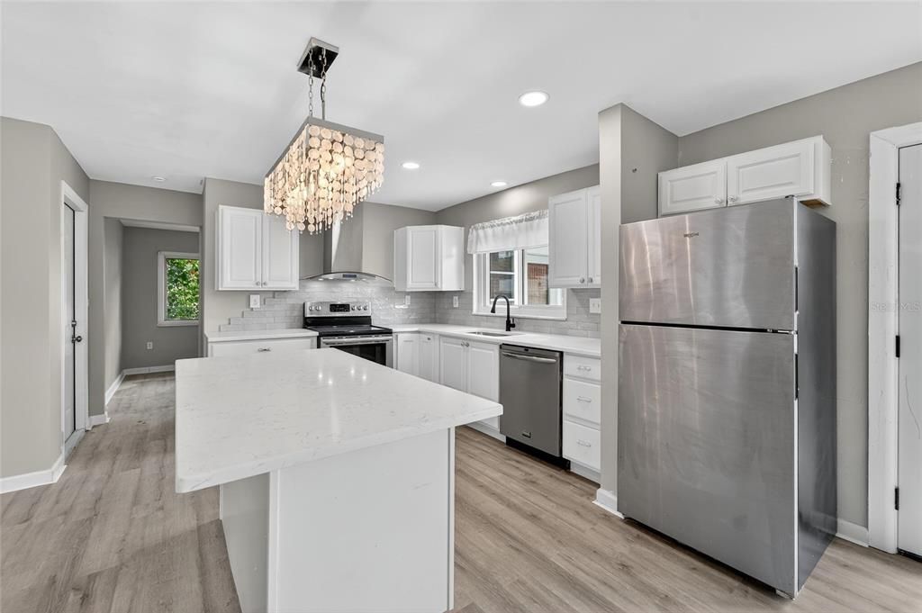 Chandelier, Interior, Kitchen, Recessed Lighting, Stainless Steel Appliances, Wood Texture Flooring