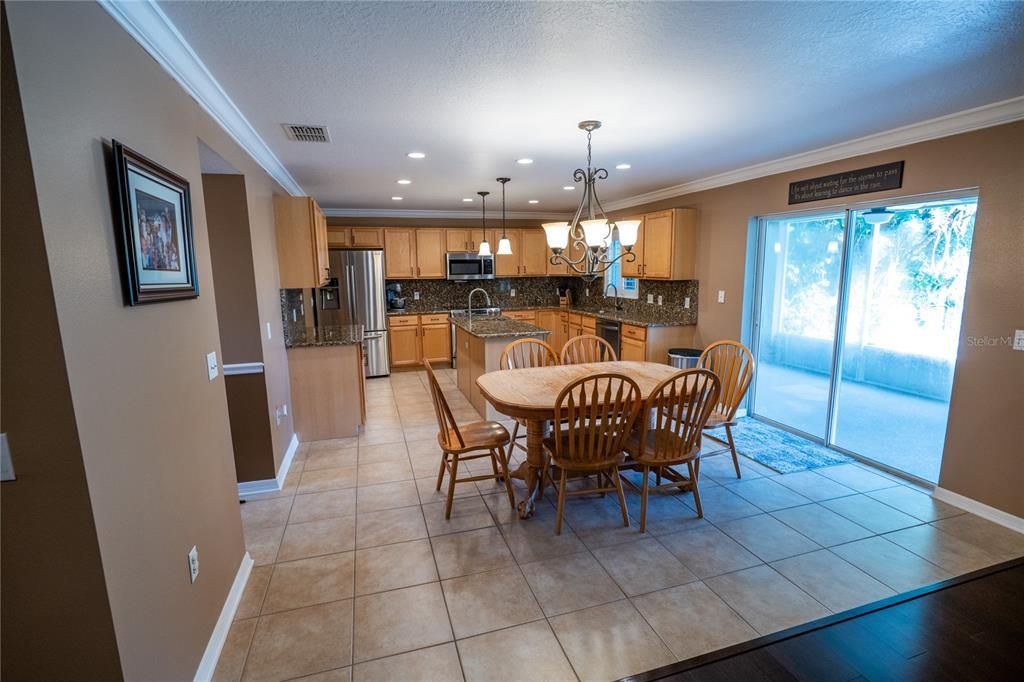 Chandelier, Dining room, Interior, Kitchen, Pendant Lights, Recessed Lighting, Stainless Steel Appliances