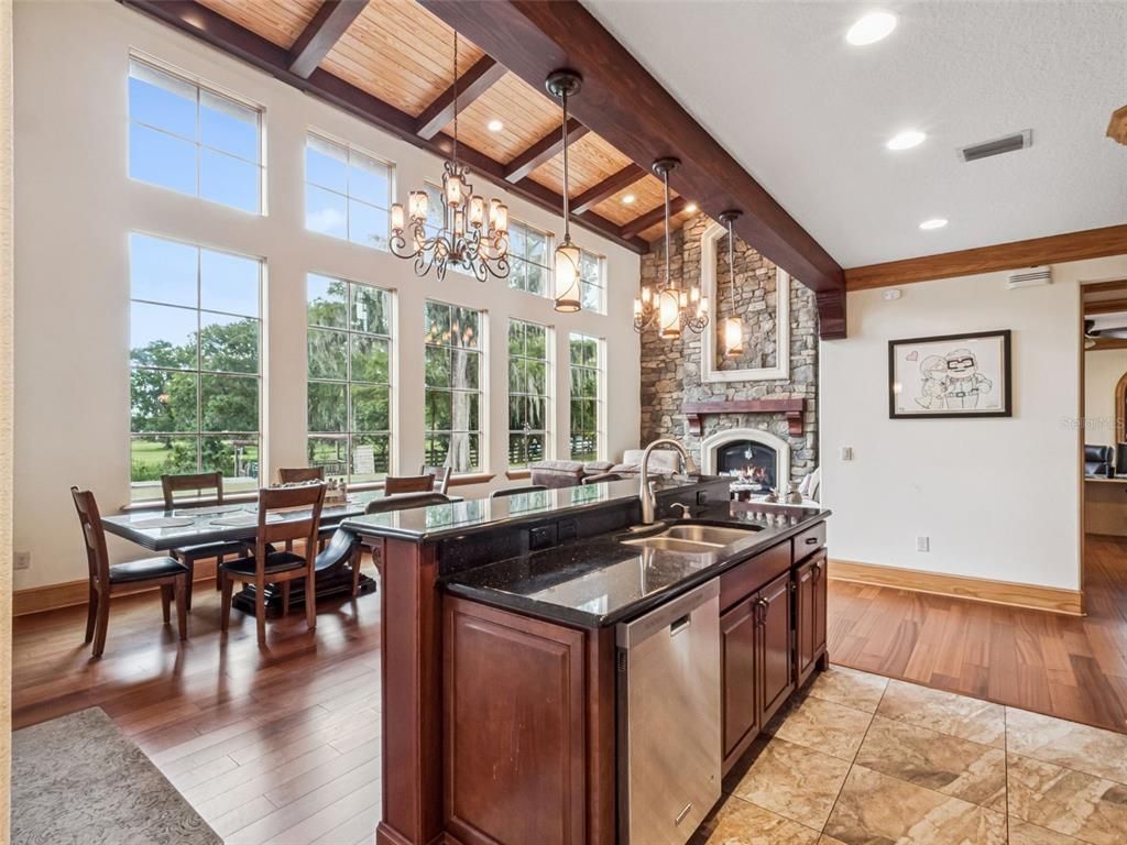 Chandelier, Dining room, Fireplace, Interior, Kitchen, Recessed Lighting, Wooden Beams, Wooden Ceilings, Wood Texture Flooring