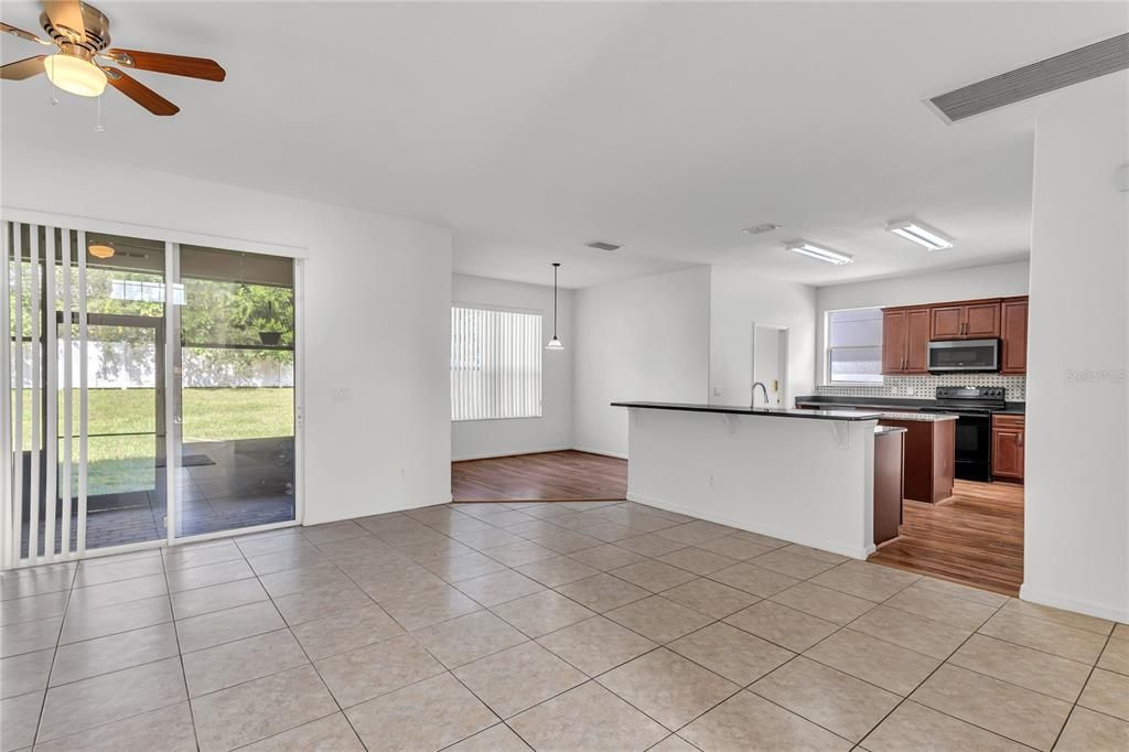 Empty room, Interior, Kitchen, Pendant Lights, Stainless Steel Appliances, Wood Texture Flooring