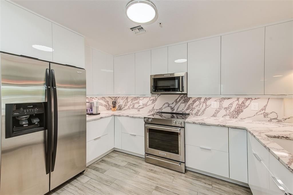 Interior, Kitchen, Marble Walls, Stainless Steel Appliances, Wood Texture Flooring