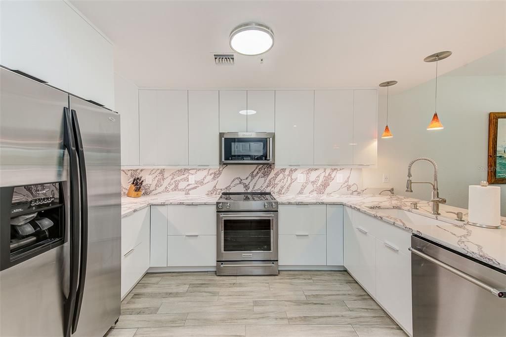 Interior, Kitchen, Marble Walls, Pendant Lights, Stainless Steel Appliances, Wood Texture Flooring
