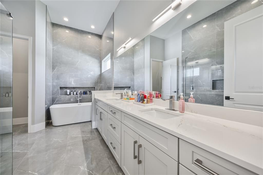 Bathroom, Dual Sink Vanities, Free Standing Baths, Glass Shower, Interior, Marble, Marble Walls, Recessed Lighting